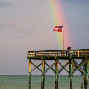 Rainbow and American Flag Over South Carolina Pier